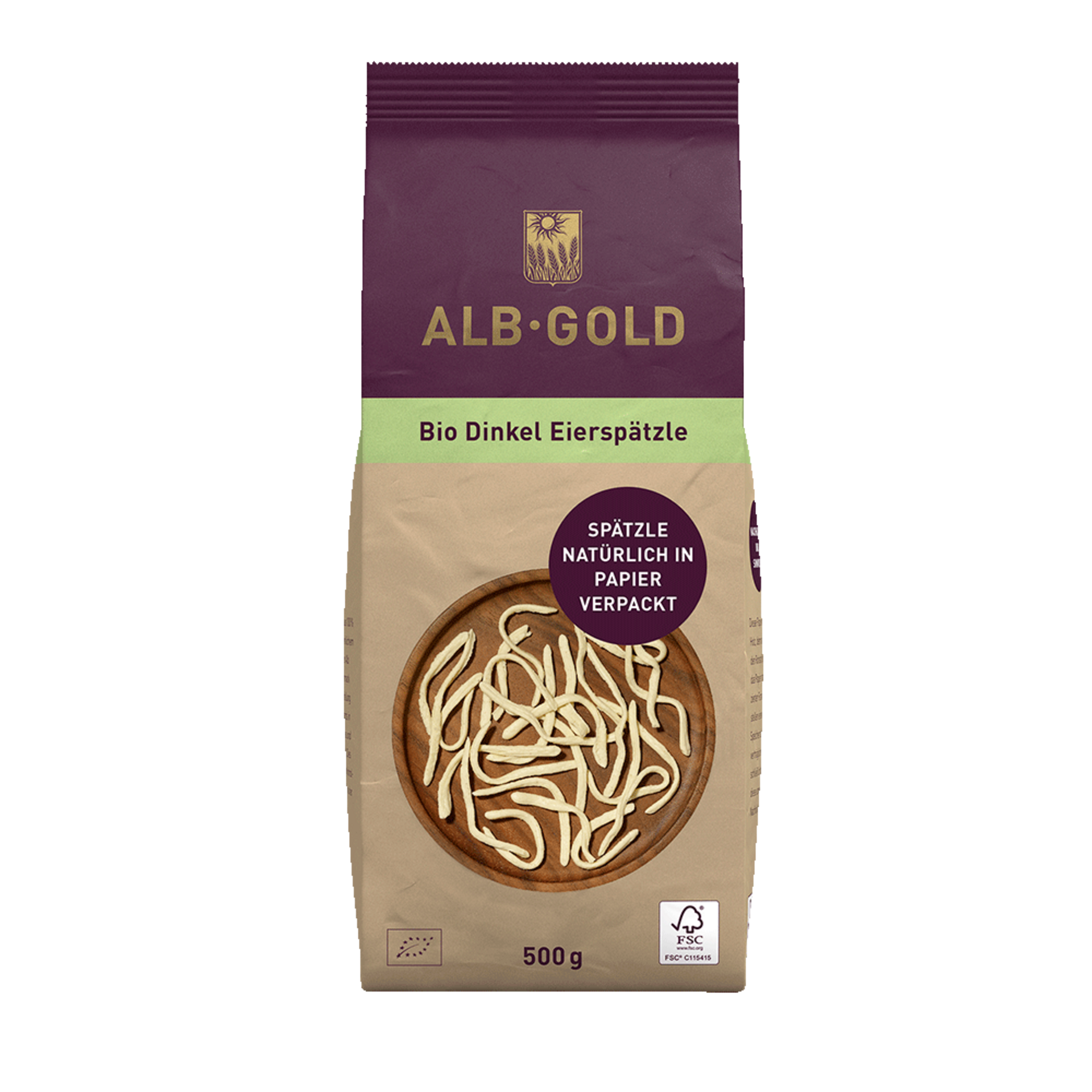 Packung Alb-Gold Bio Dinkel Eierspätzle, 500 g, natürlich in Papier verpackt, mit Spätzle auf Holzplatte abgebildet